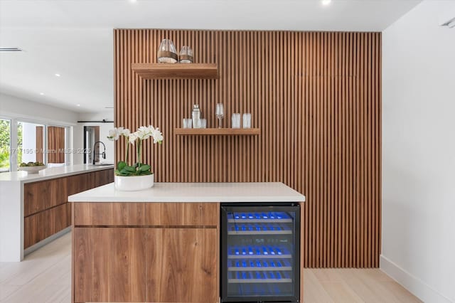 bar featuring visible vents, wine cooler, a bar, a sink, and recessed lighting