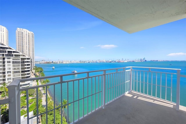 balcony featuring a water view