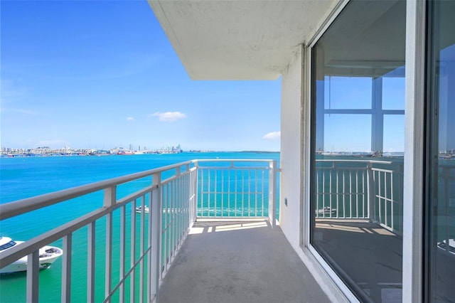 balcony featuring a water view