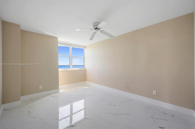 unfurnished room featuring ceiling fan