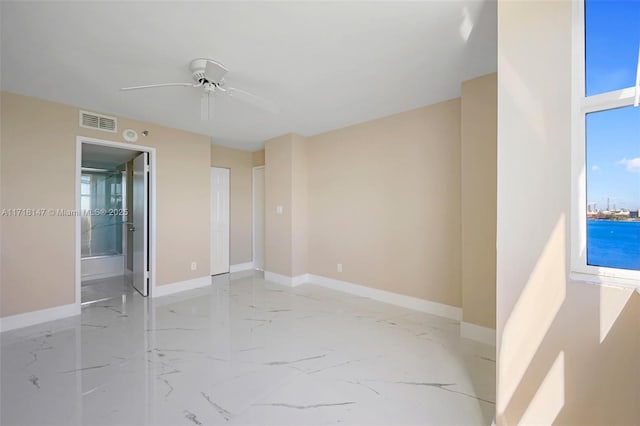 unfurnished room featuring ceiling fan