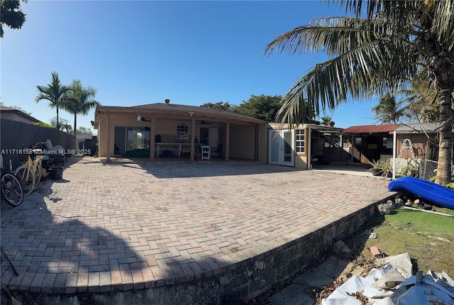 back of house with a patio area