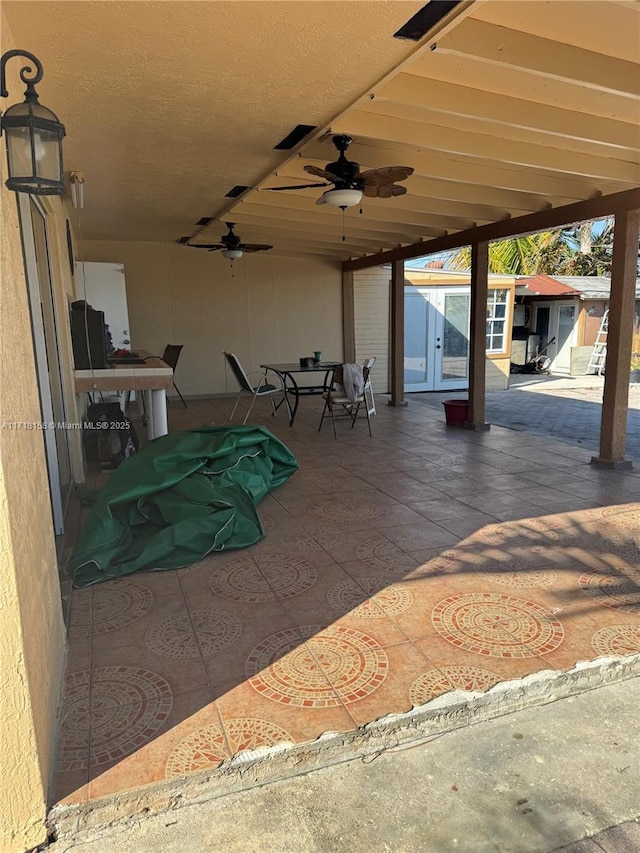 view of patio featuring ceiling fan