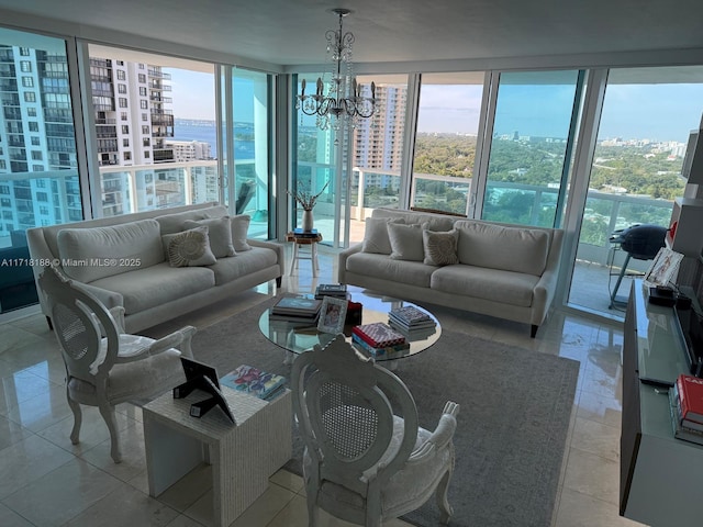 tiled living room with expansive windows, a wealth of natural light, and a notable chandelier