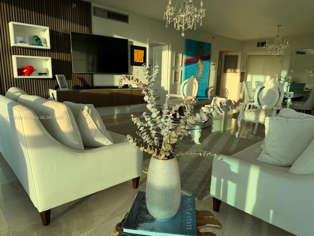 living room featuring tile patterned flooring and a chandelier