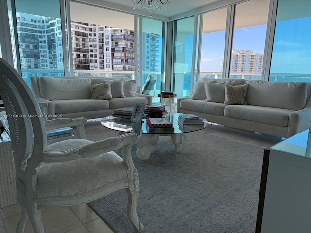 living room featuring tile patterned floors and a notable chandelier