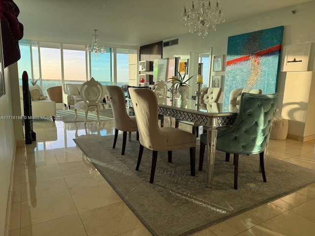 dining space featuring an inviting chandelier