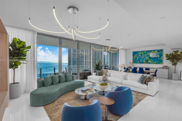 living room with expansive windows and a water view