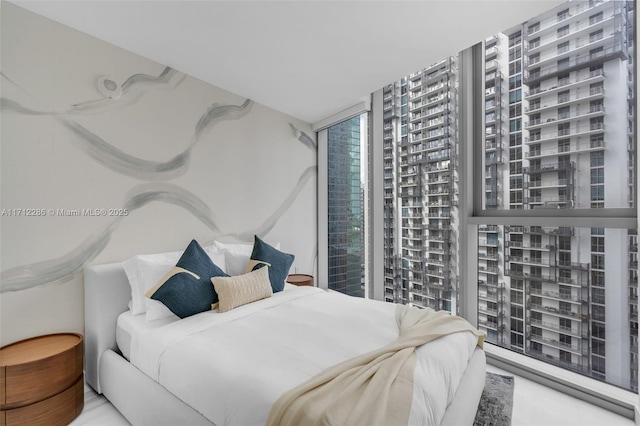 bedroom featuring a wall of windows