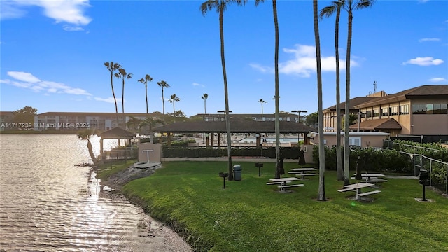 view of property's community featuring a gazebo, a water view, and a yard