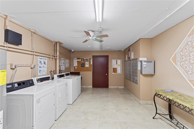 laundry area featuring washing machine and dryer and ceiling fan