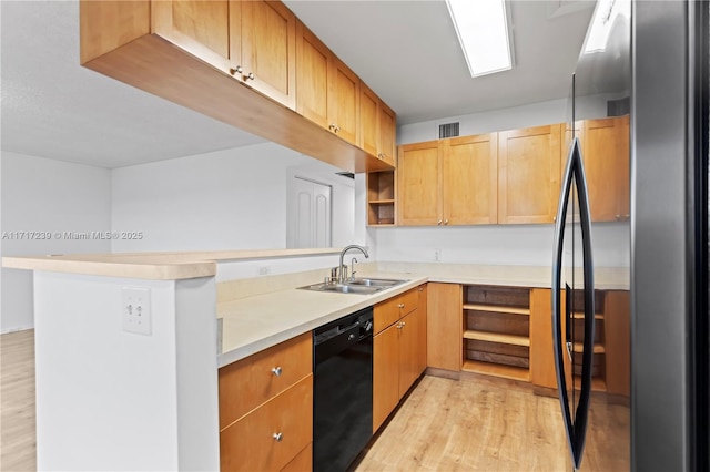 kitchen with stainless steel refrigerator, sink, black dishwasher, light hardwood / wood-style flooring, and kitchen peninsula