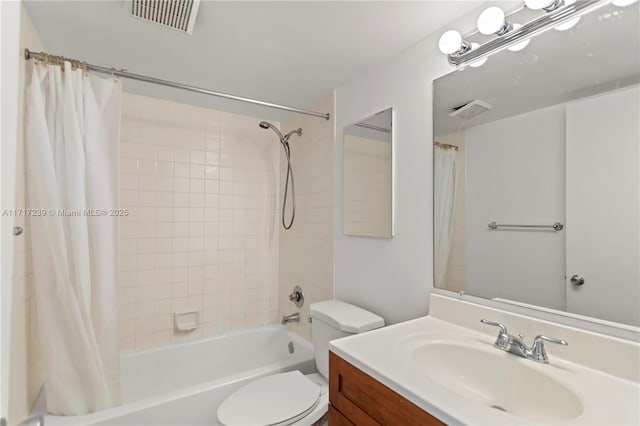 full bathroom with shower / bath combination with curtain, vanity, and toilet