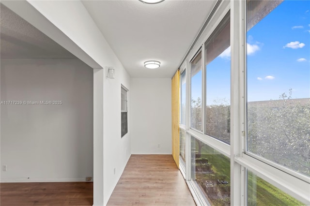 hall featuring light hardwood / wood-style flooring