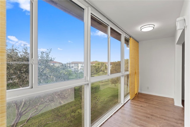 unfurnished sunroom with plenty of natural light