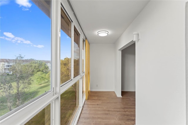 hall with light hardwood / wood-style flooring