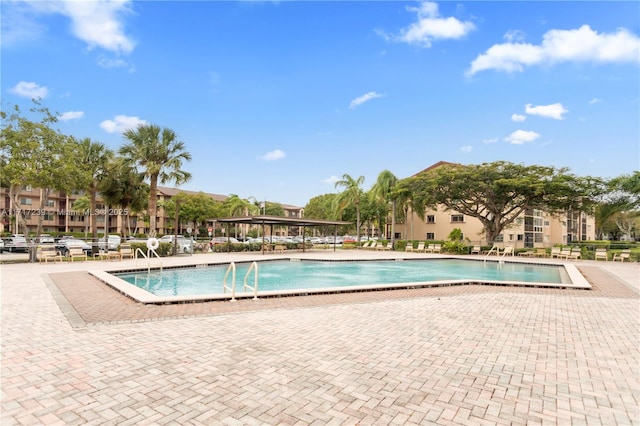 view of swimming pool with a patio