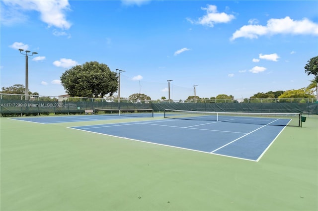 view of tennis court with basketball court