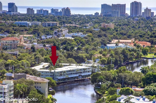 birds eye view of property featuring a water view