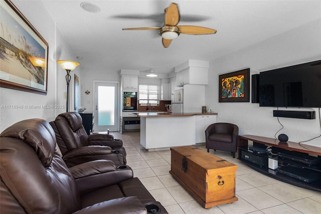 living room featuring ceiling fan and light tile patterned floors