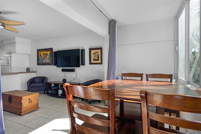 dining space with ceiling fan and light tile patterned floors