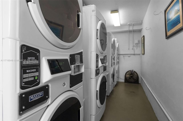 washroom with independent washer and dryer and stacked washer and clothes dryer