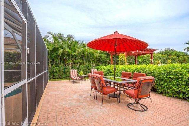 view of patio / terrace with a lanai