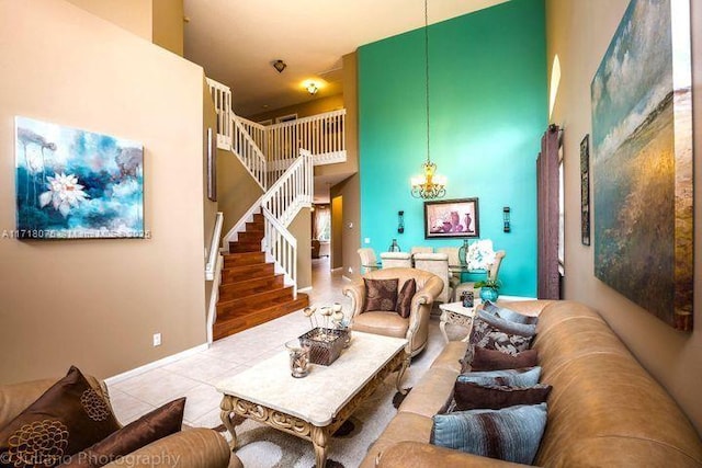 living room featuring a high ceiling, a notable chandelier, and tile patterned flooring