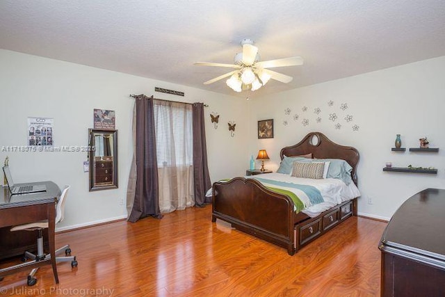 bedroom featuring ceiling fan and wood-type flooring