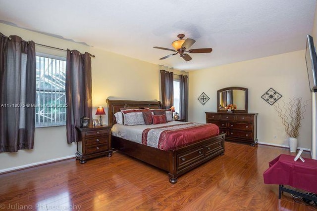 bedroom featuring ceiling fan and hardwood / wood-style flooring