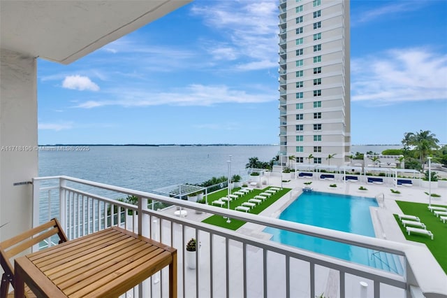 balcony featuring a water view