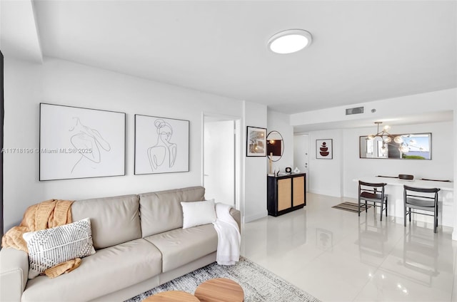 living room featuring a notable chandelier