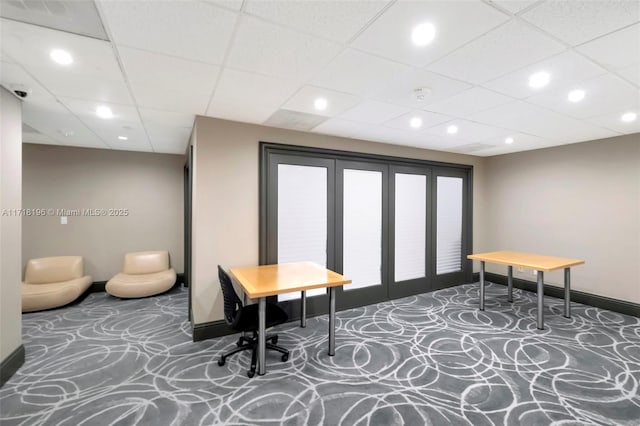 home office with a paneled ceiling