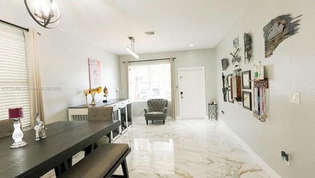 dining room featuring a notable chandelier