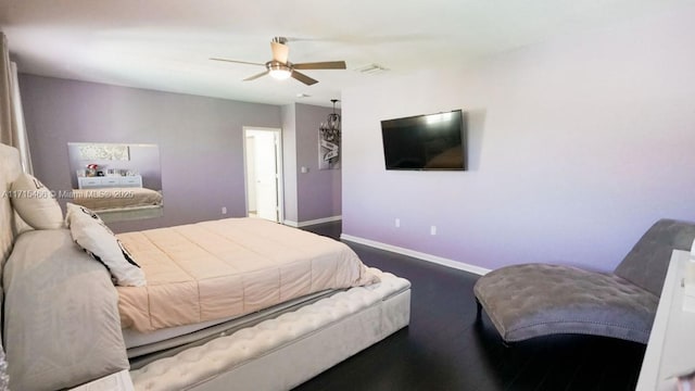 bedroom with ceiling fan and dark wood-type flooring