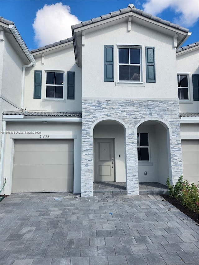 view of front of property with a garage