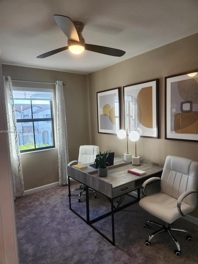 carpeted home office with ceiling fan