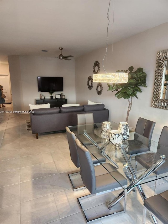 dining area featuring ceiling fan and light tile patterned floors