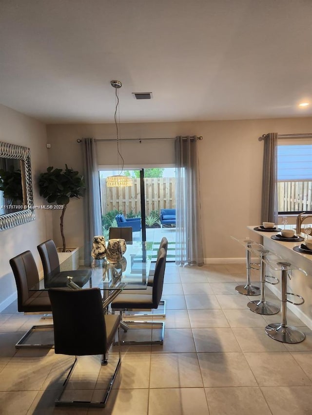 dining area featuring a healthy amount of sunlight and light tile patterned floors