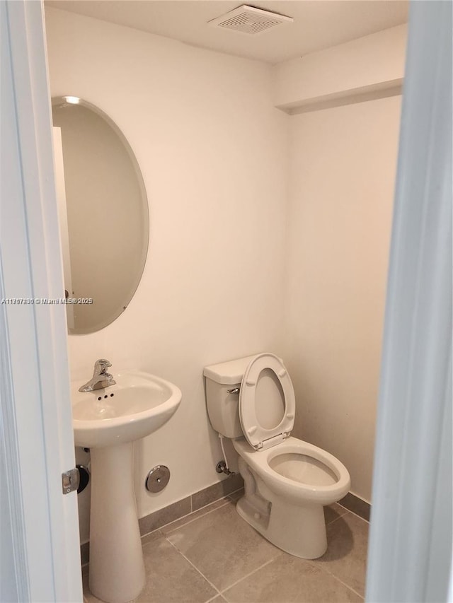 bathroom featuring tile patterned floors and toilet