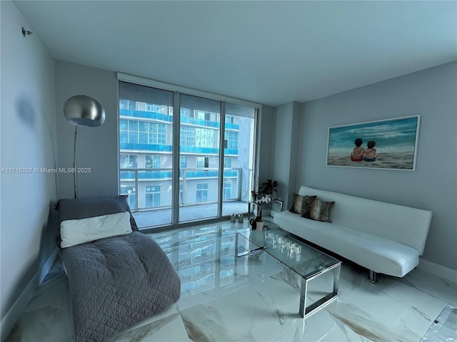 living room featuring floor to ceiling windows