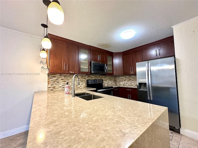 kitchen featuring kitchen peninsula, decorative backsplash, stainless steel appliances, sink, and pendant lighting