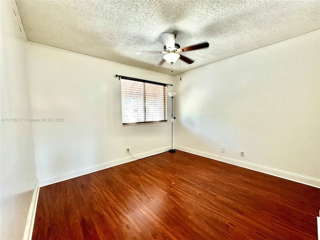 spare room with hardwood / wood-style flooring, ceiling fan, and a textured ceiling