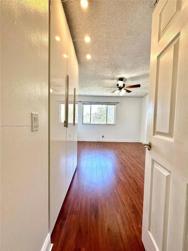 hall with dark hardwood / wood-style flooring