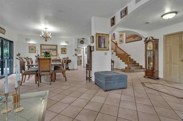 tiled living room featuring ceiling fan and a raised ceiling