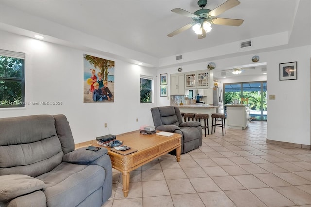 kitchen featuring white cabinets, a kitchen island, sink, and stainless steel appliances