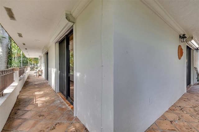 view of patio featuring a balcony