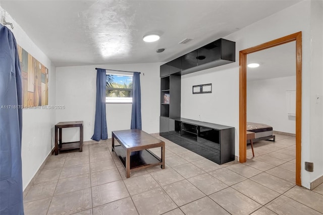 bathroom featuring tile patterned flooring, vanity, and toilet