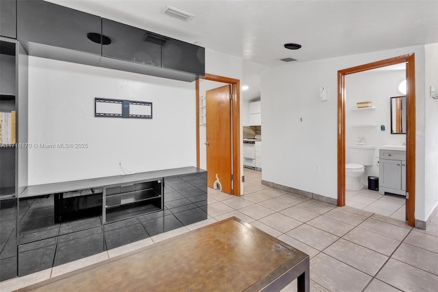 tiled dining area with vaulted ceiling and a wealth of natural light