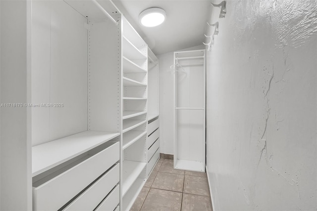 kitchen featuring white range oven, backsplash, white cabinetry, and sink